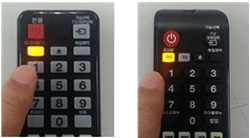 홈시어터와 TV를 HDMI 케이블로 연결하기 위해 리모컨 주황색 버튼 눌림